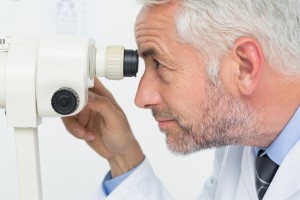 Close-up side view of a senior optician